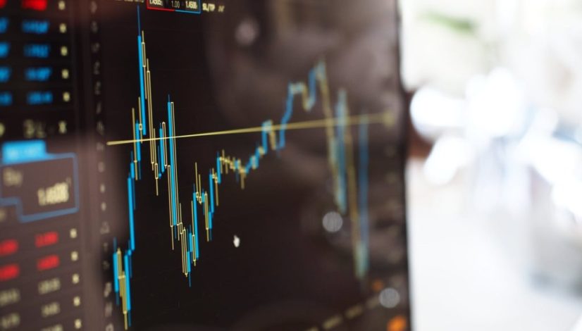 blue and yellow graph on stock market monitor