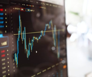 blue and yellow graph on stock market monitor