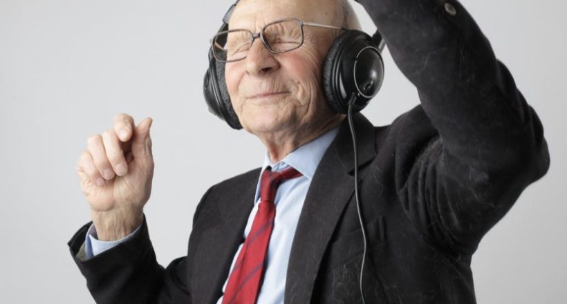 man in black jacket wearing black headphones