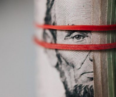 roll of american dollar banknotes tightened with band