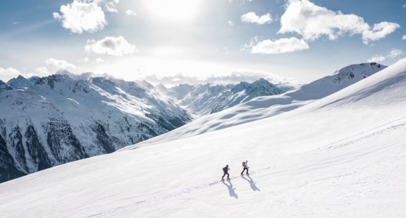 two man hiking on snow mountain