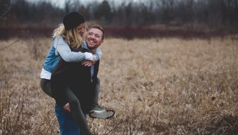 photo of a man carrying his partner