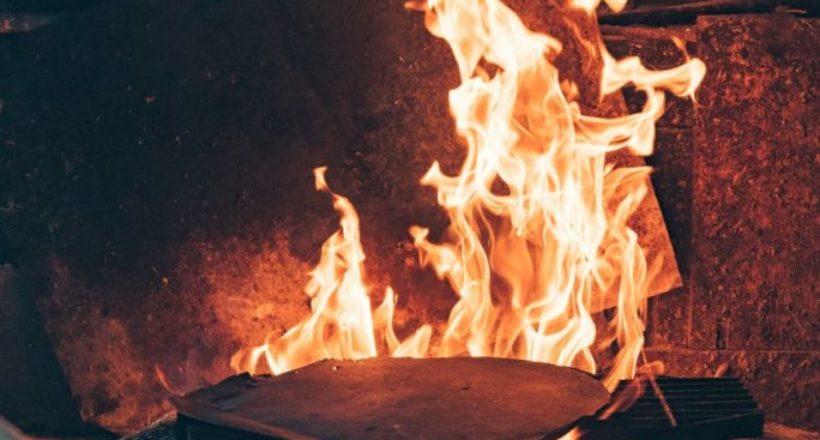 blue corn tortilla roasting in fireplace